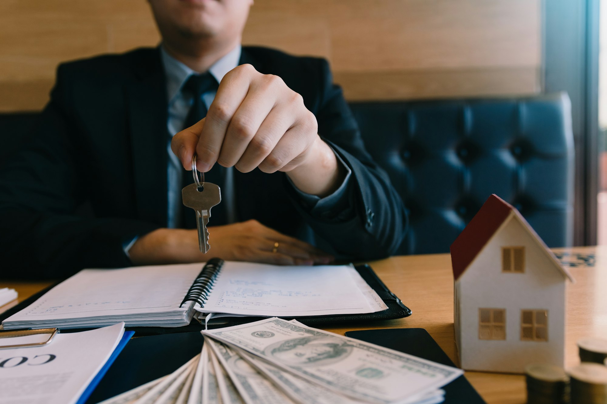 Home buying broker holding the key.